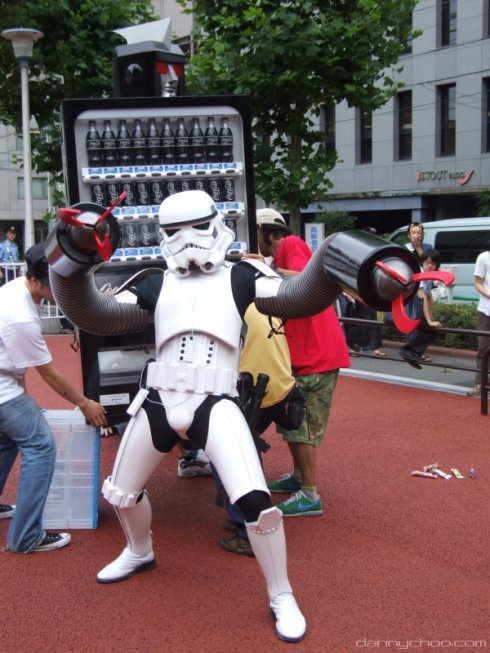 Anime Look-Alike : Danny Choo clad in a Stormtrooper costume terrorizing the demonstrators with his new found attachments.